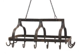 A country kitchen wrought iron pot rack,