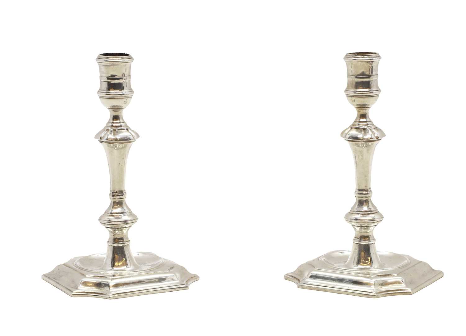 A pair of George II-style cast silver candlesticks