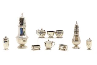 A collection of silver cruet items