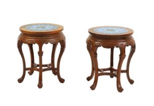 A pair of Chinese circular hardwood side tables,