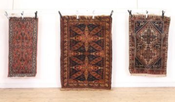 A group of three rugs
