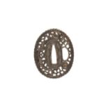 A Japanese Namban School pierced iron tsuba,