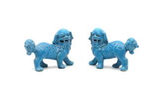 A pair of Chinese blue-glazed figurines,