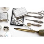 A collection of silver novelty items