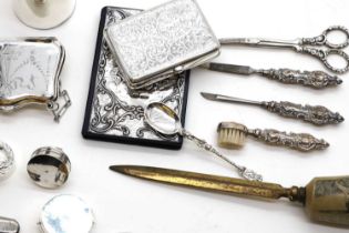 A collection of silver novelty items