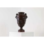 A bronzed calamine urn,