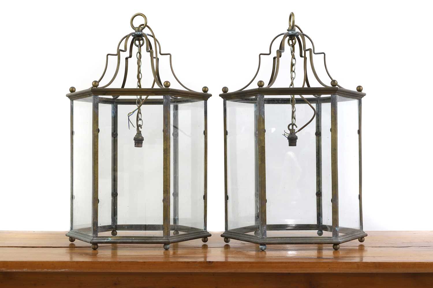 A pair of George III style hall brass lanterns,