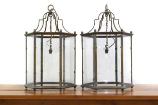 A pair of George III style hall brass lanterns,