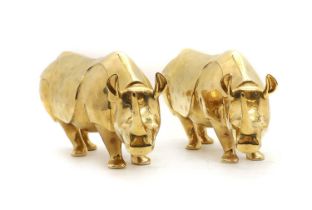 A pair of gilt porcelain rhinoceros