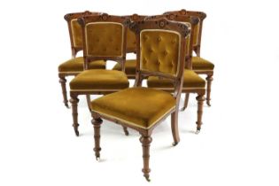 A matched set of six oak and dining chairs,