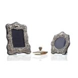 Two silver easel back photograph frames,