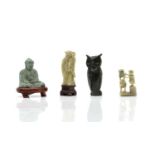 A collection of carved soapstone figures,