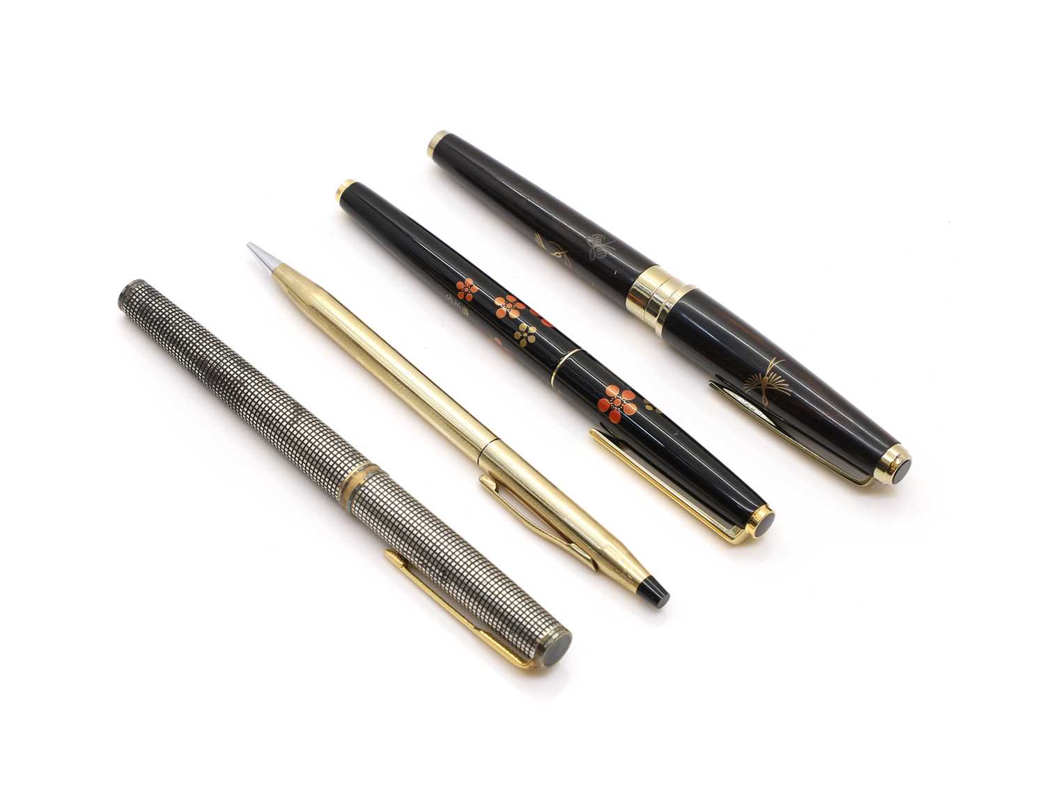 A group of three fountain pens