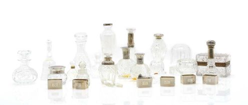 A group of five silver mounted cut glass bottles