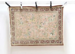 A hand knotted part silk rug