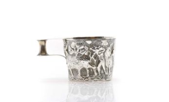 A silver repousse mug,