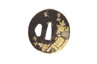 A Japanese iron and gold tsuba,