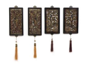 Two pairs of Chinese gilt lacquered wood panels,