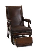 A mahogany and leather reclining library armchair,