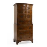 A reproduction bow front walnut chest on chest