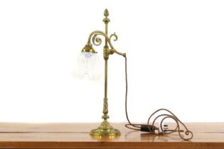 A table lamp with a vaseline glass shade