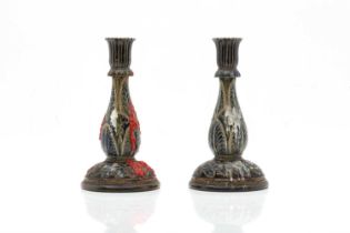 A pair of Doulton Lambeth stoneware candlesticks,