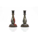 A pair of Doulton Lambeth stoneware candlesticks,