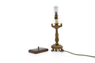 A gilt metal candlestick converted to a lamp,