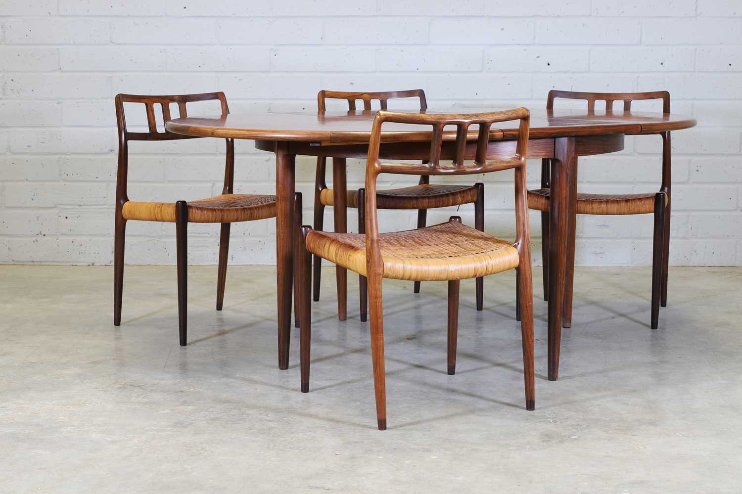 § A Danish rosewood dining suite,