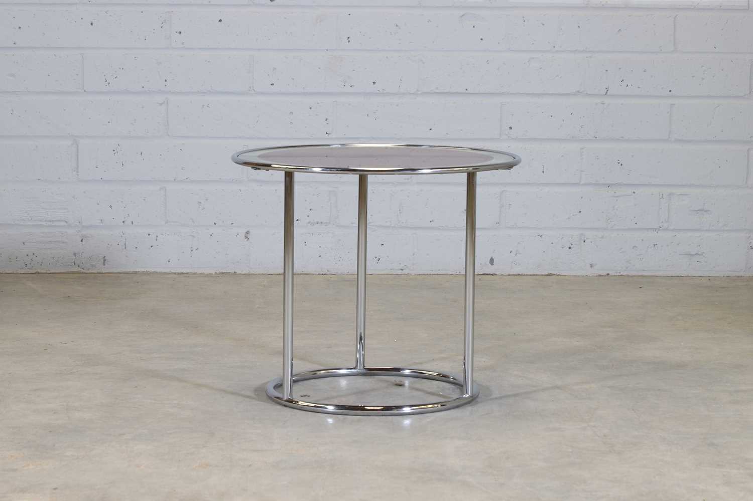 A modernist chrome and glass centre table,