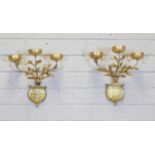A pair of gold-painted three-branch wall lights,