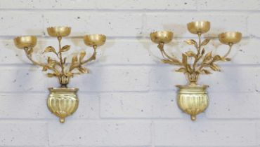 A pair of gold-painted three-branch wall lights,