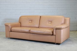 A tan leather settee,