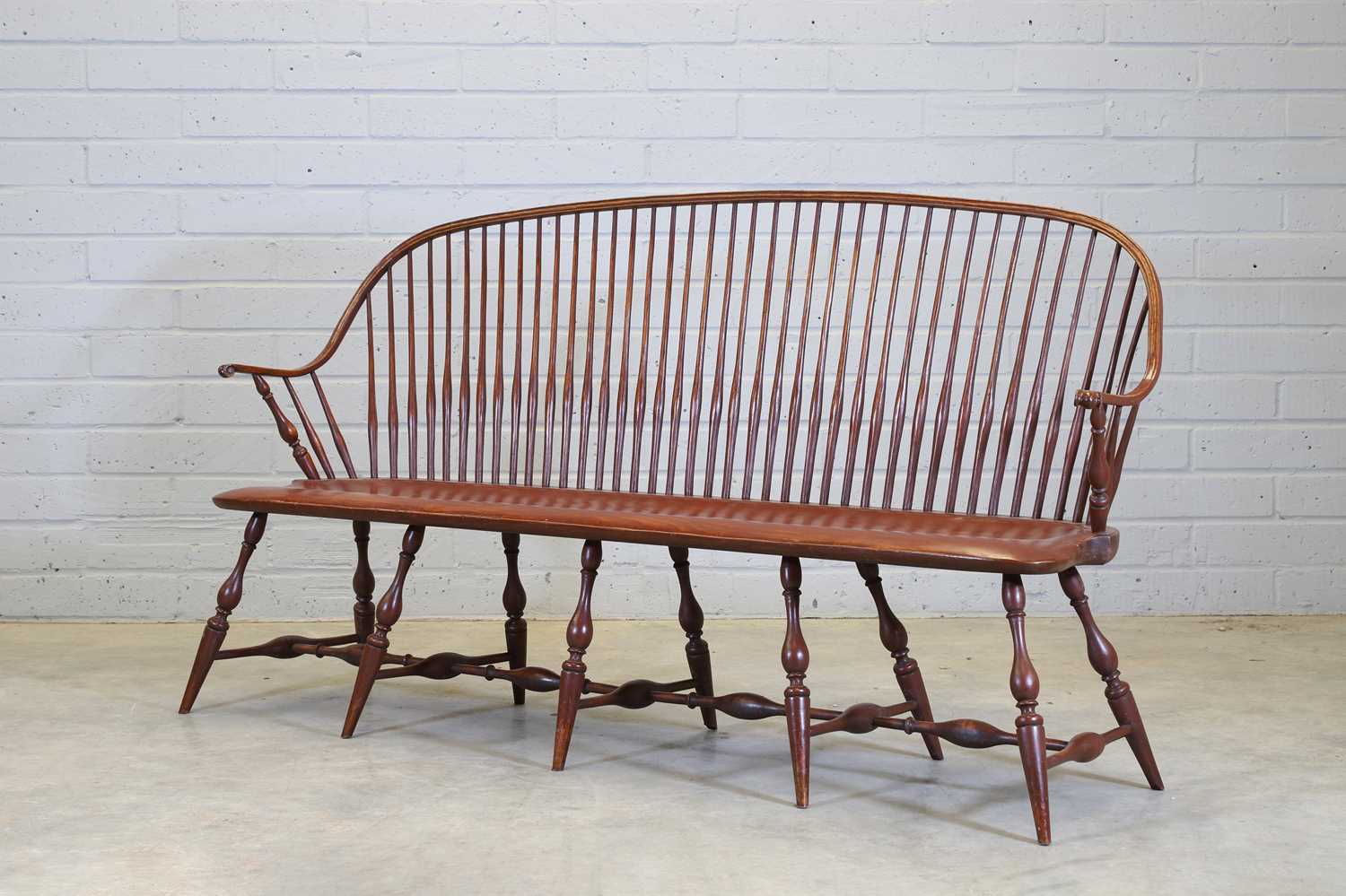 An American elm model 'SCH5a Continuous Arm Settee',