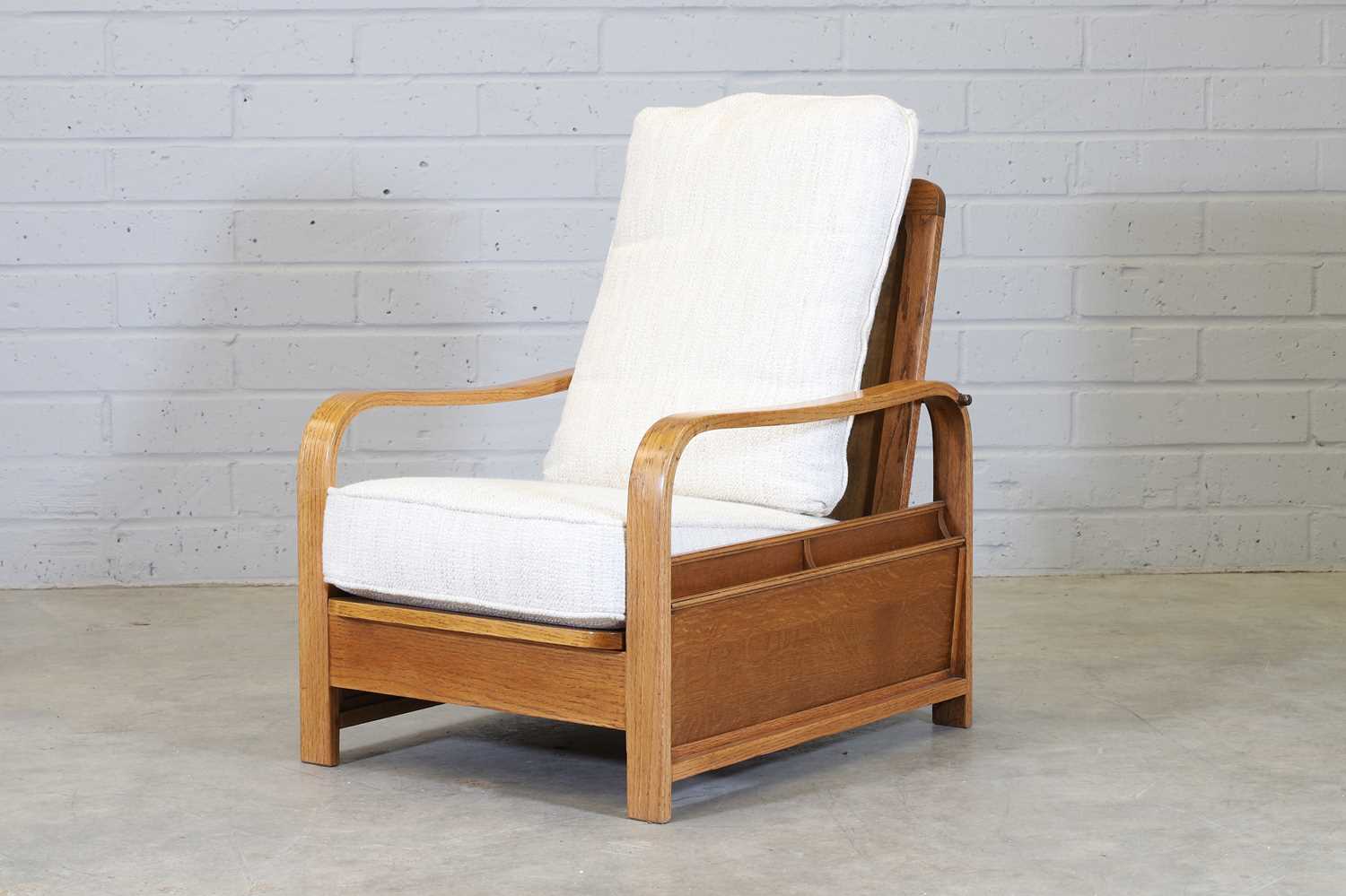 An oak reclining reading chair,