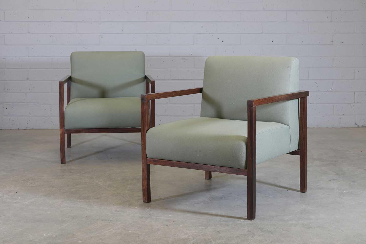 § A pair of Brazilian rosewood armchairs,