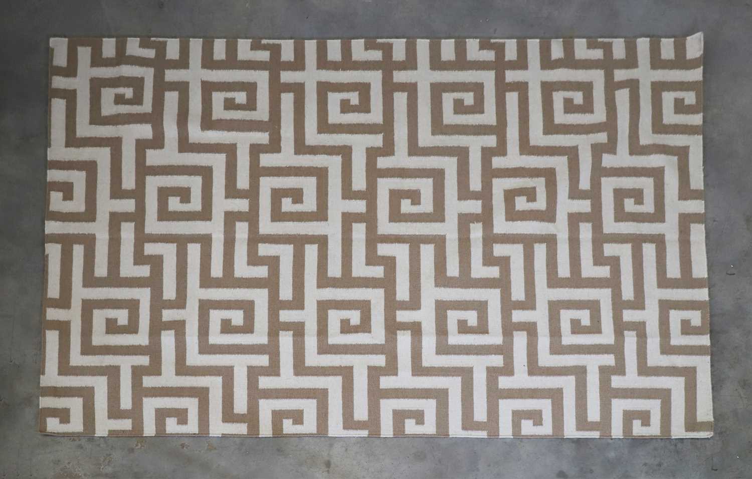 A contemporary flat-weave rug,