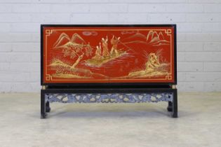 A chinoiserie ebonised and lacquered sideboard,