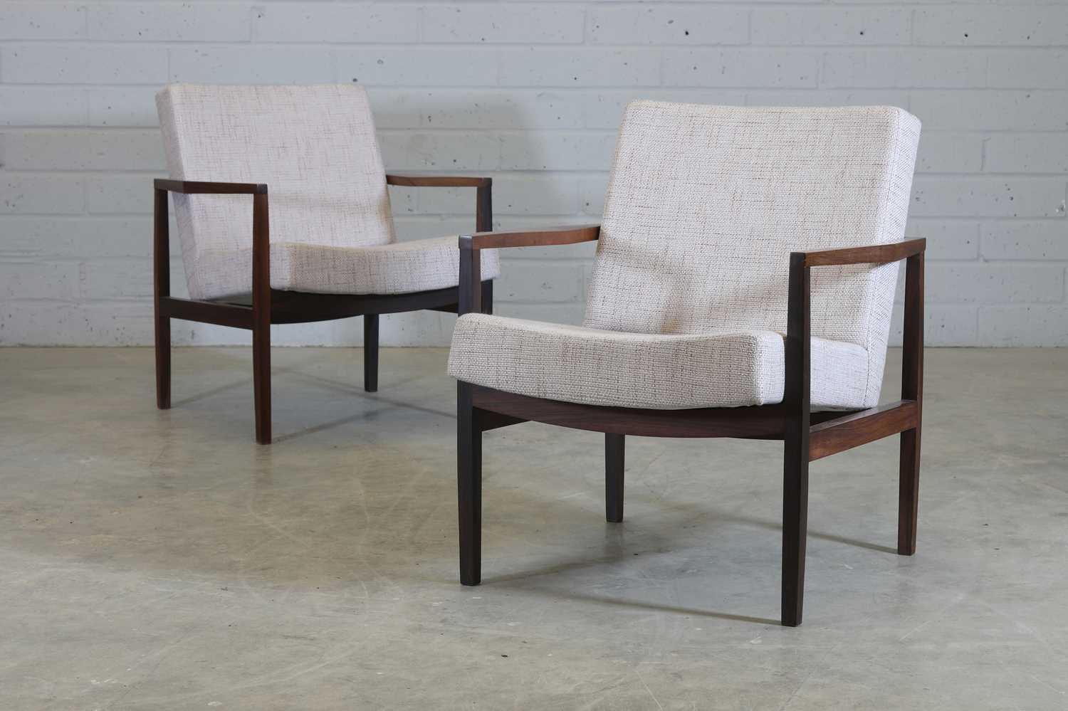 § A pair of Brazilian rosewood armchairs,