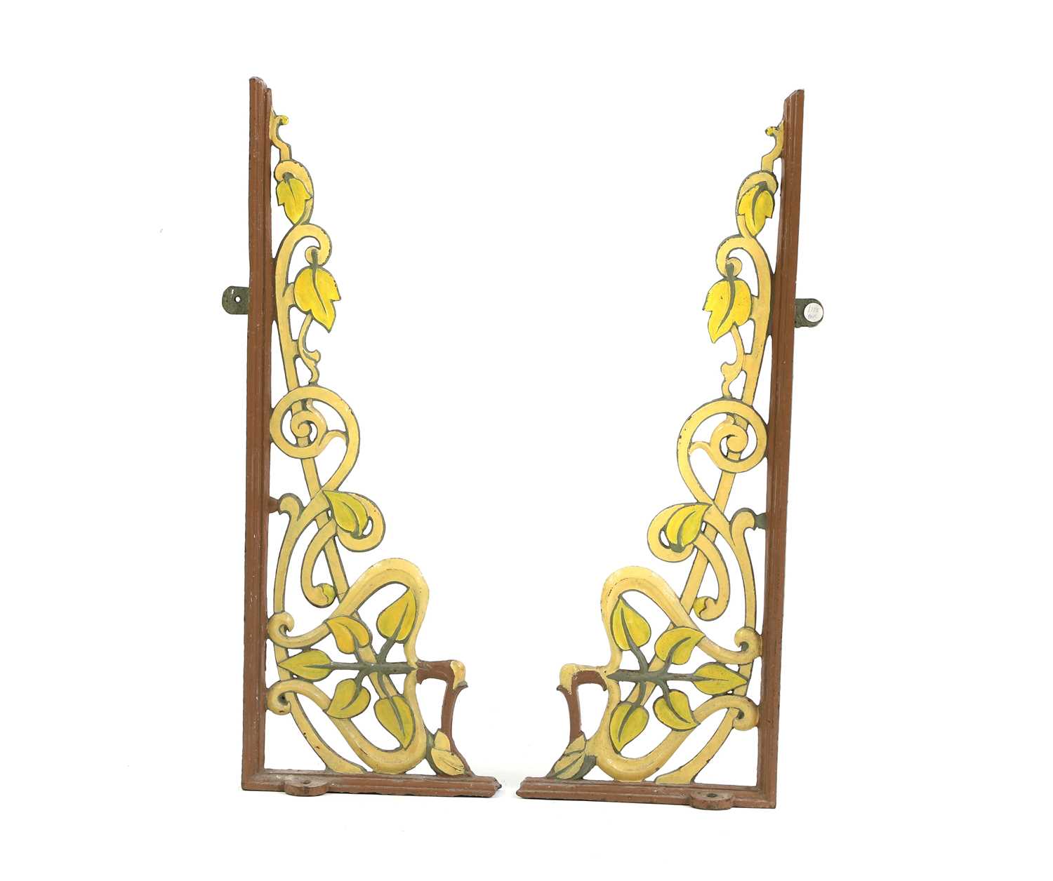 A pair of cast and wrought-iron wall brackets,