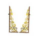 A pair of cast and wrought-iron wall brackets,