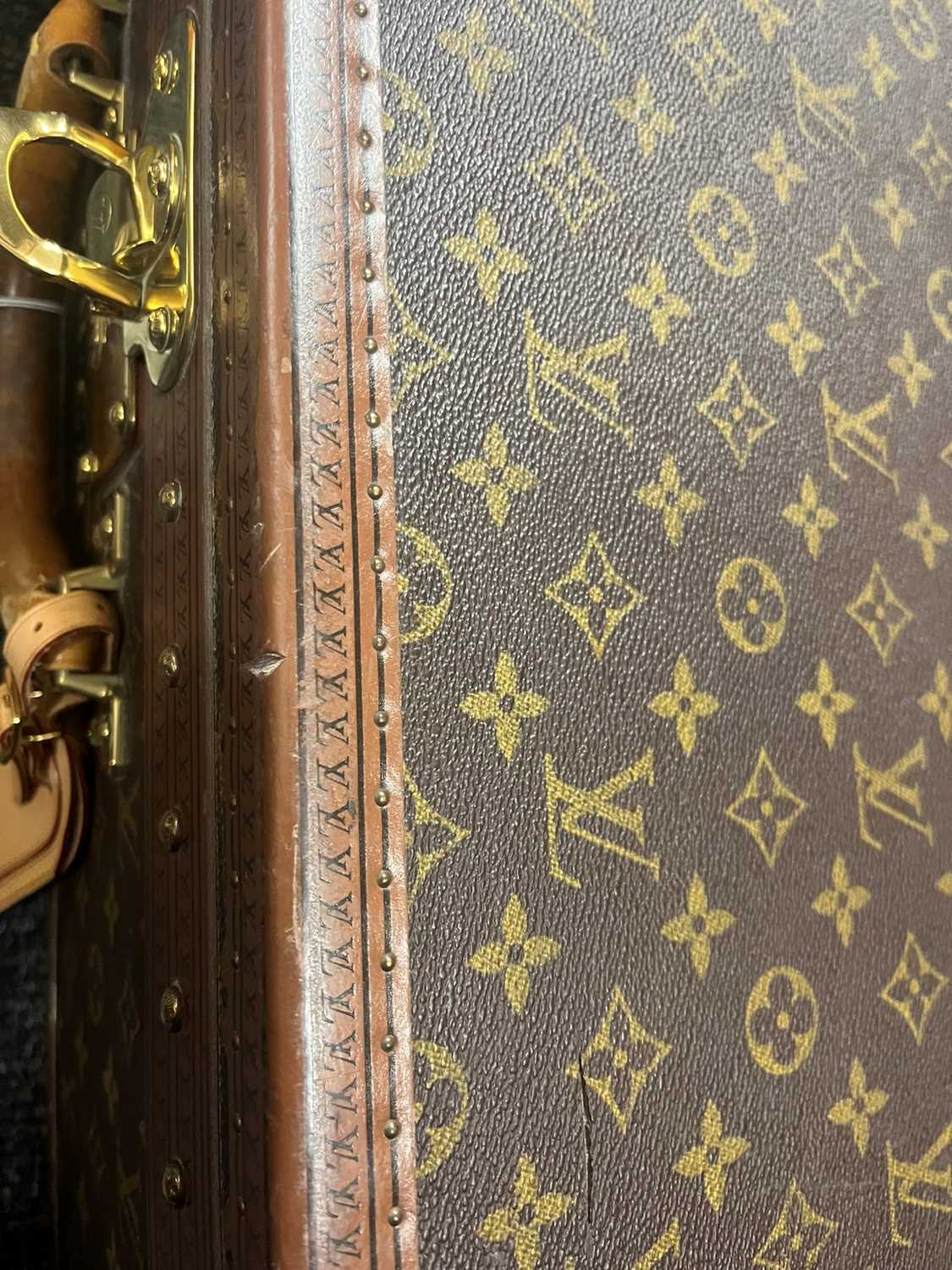 A Louis Vuitton monogrammed canvas 'Alzer 65' suitcase, - Image 24 of 28