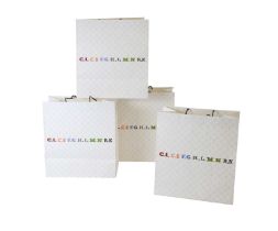 Four Louis Vuitton 160th Anniversary monogrammed paper commemorative shopping bags,