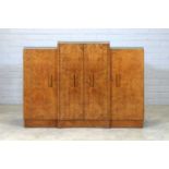 An Art Deco walnut breakfront sideboard,