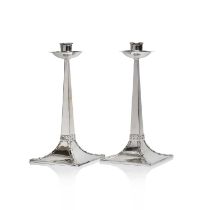 A pair of Arts and Crafts silver candlesticks,