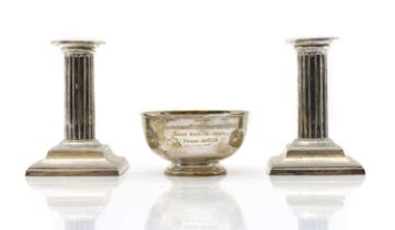 A pair of silver candlesticks,