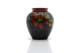 A Walter Moorcroft pottery 'Clematis' pattern vase,