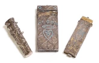 A group of three silver filagree etui