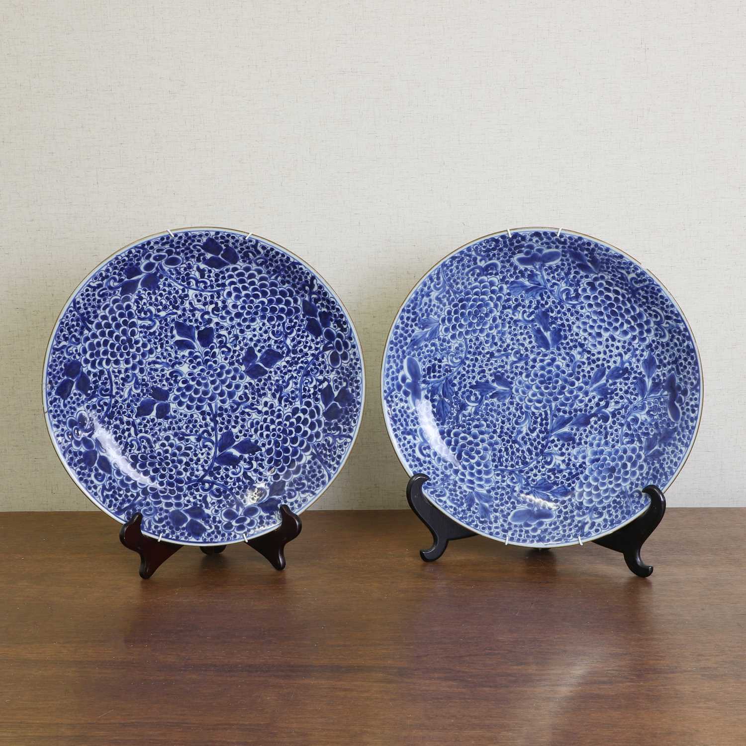 A pair of Chinese blue and white chargers,