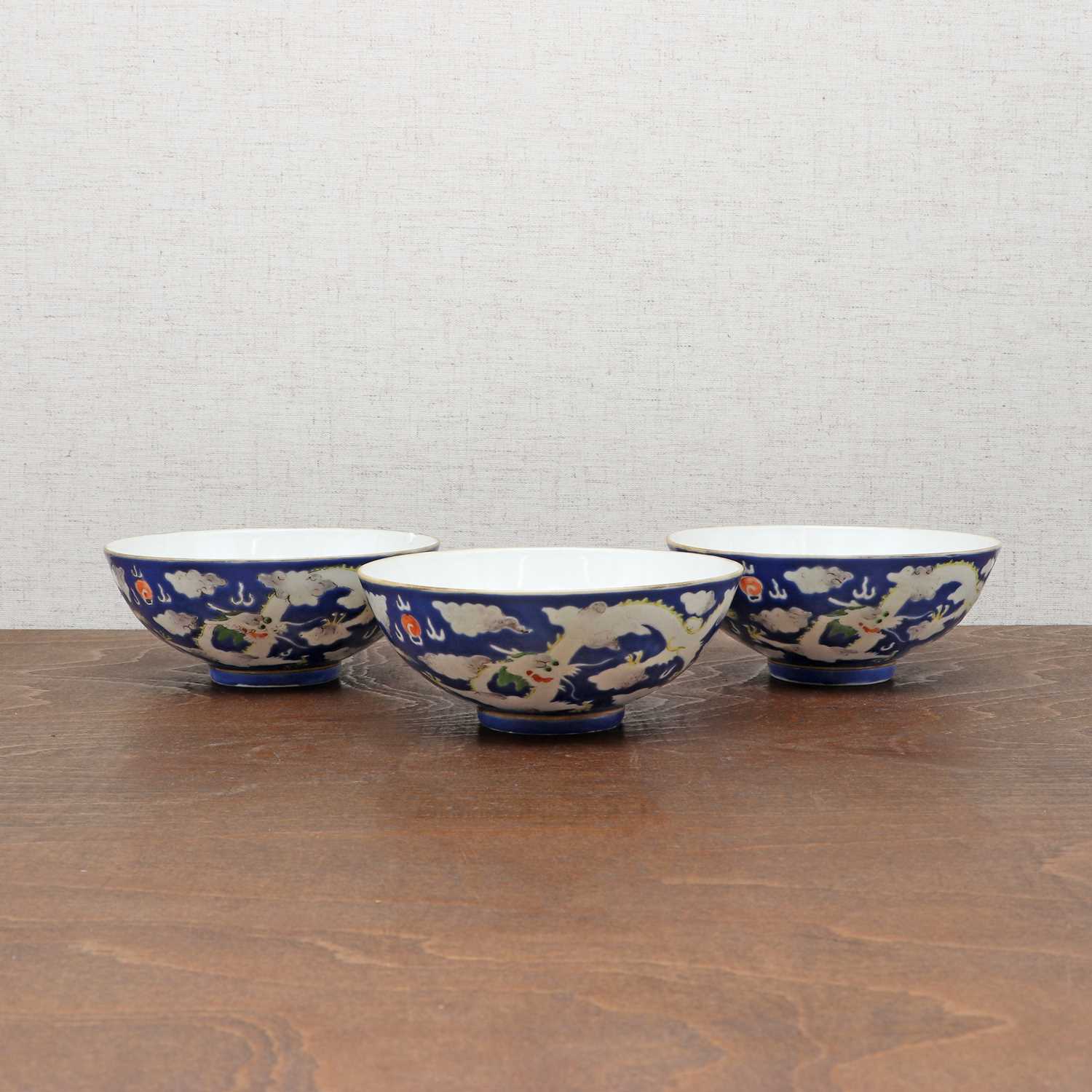 Three Chinese blue-ground white-enamelled bowls,